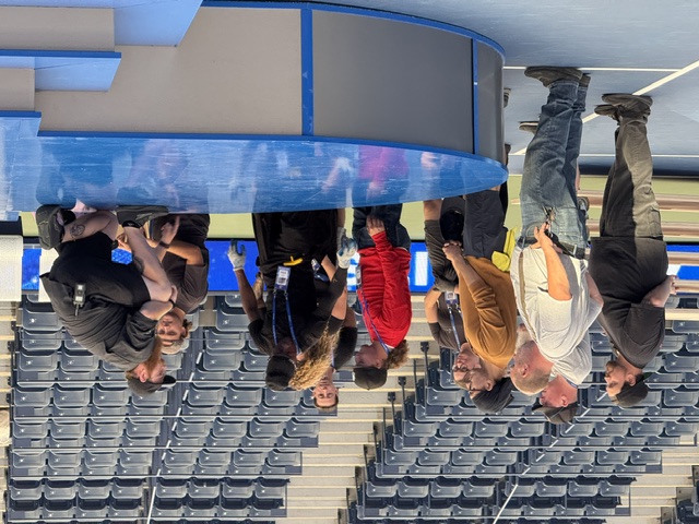 Union crew huddle at stadium event